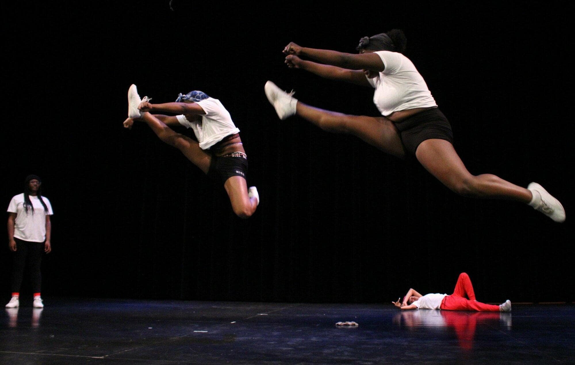 Young people performing dance on a stage